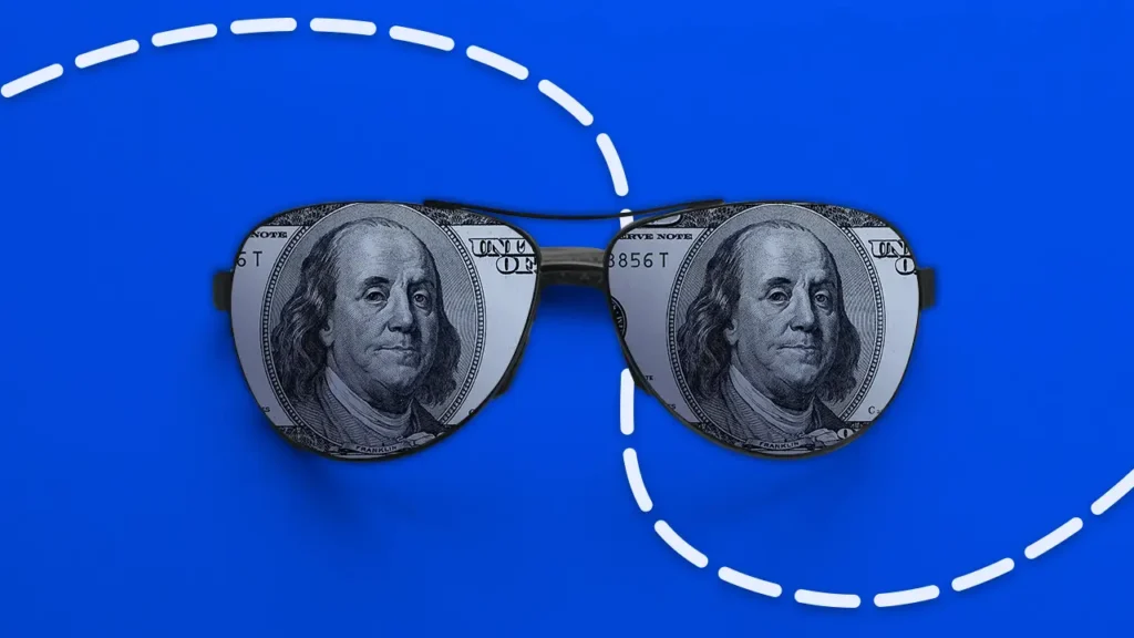 US dollar through a pair of glasses